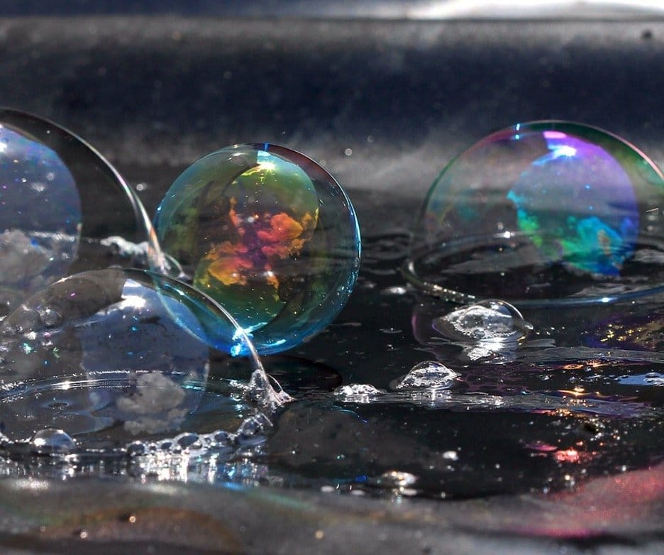 A photo of soap bubbles about to pop.