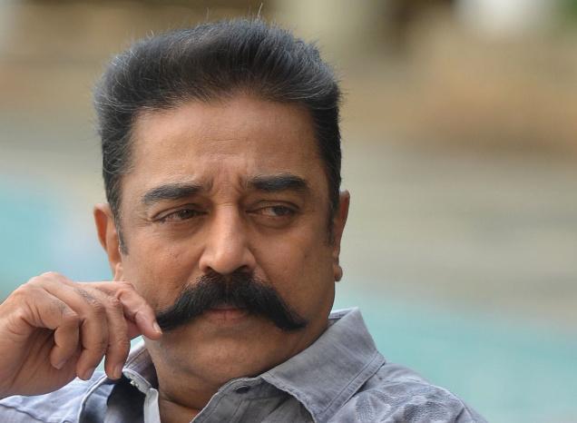 Image of Kamal Haasan, the famous actor and director, sitting in a chair.