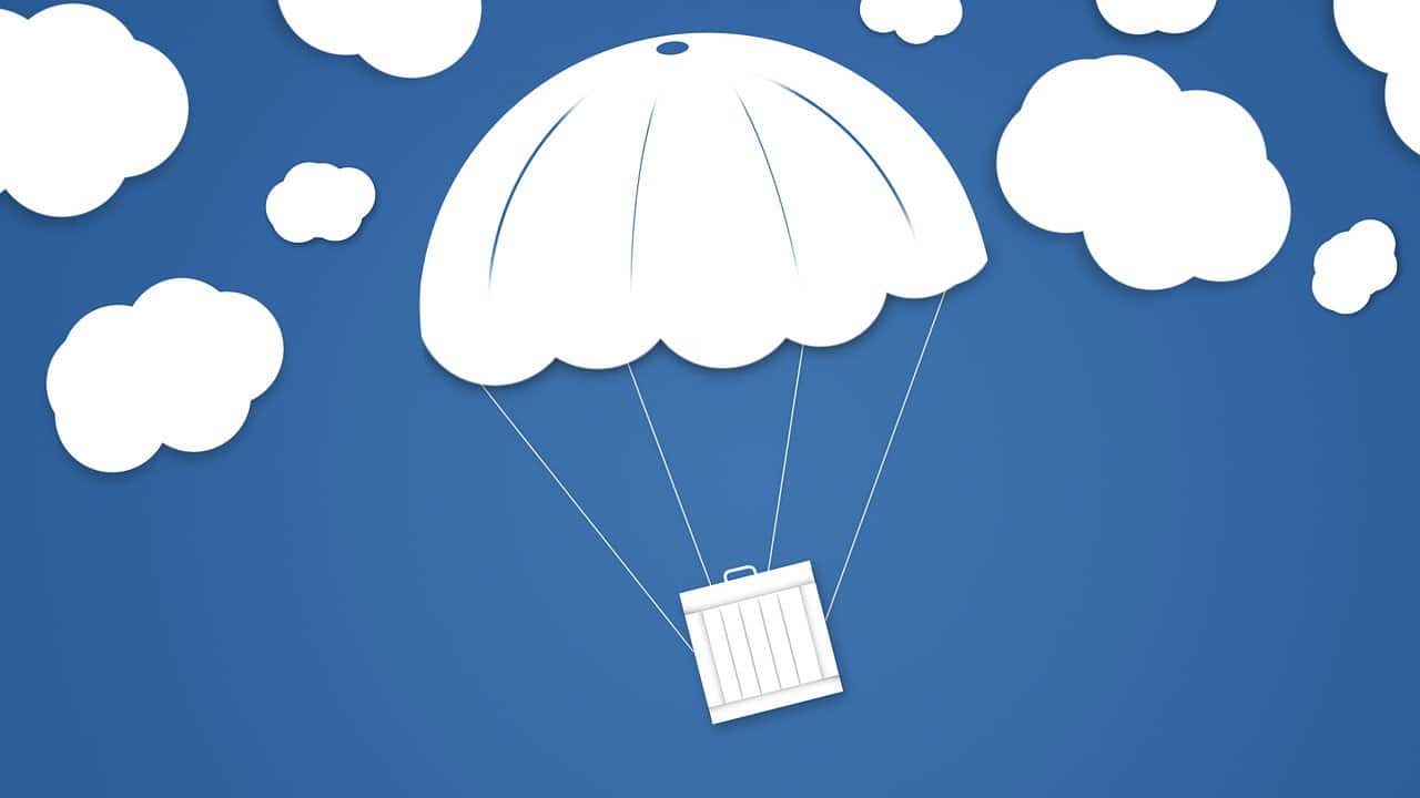 Image of a box parachuting down from the clouds, representing a token airdrop