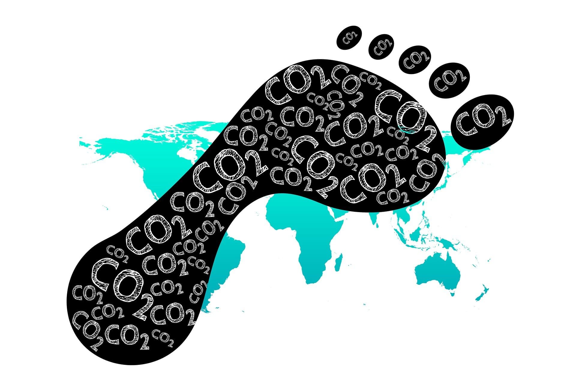 An image of a literal carbon footprint superimposed over a map of the world