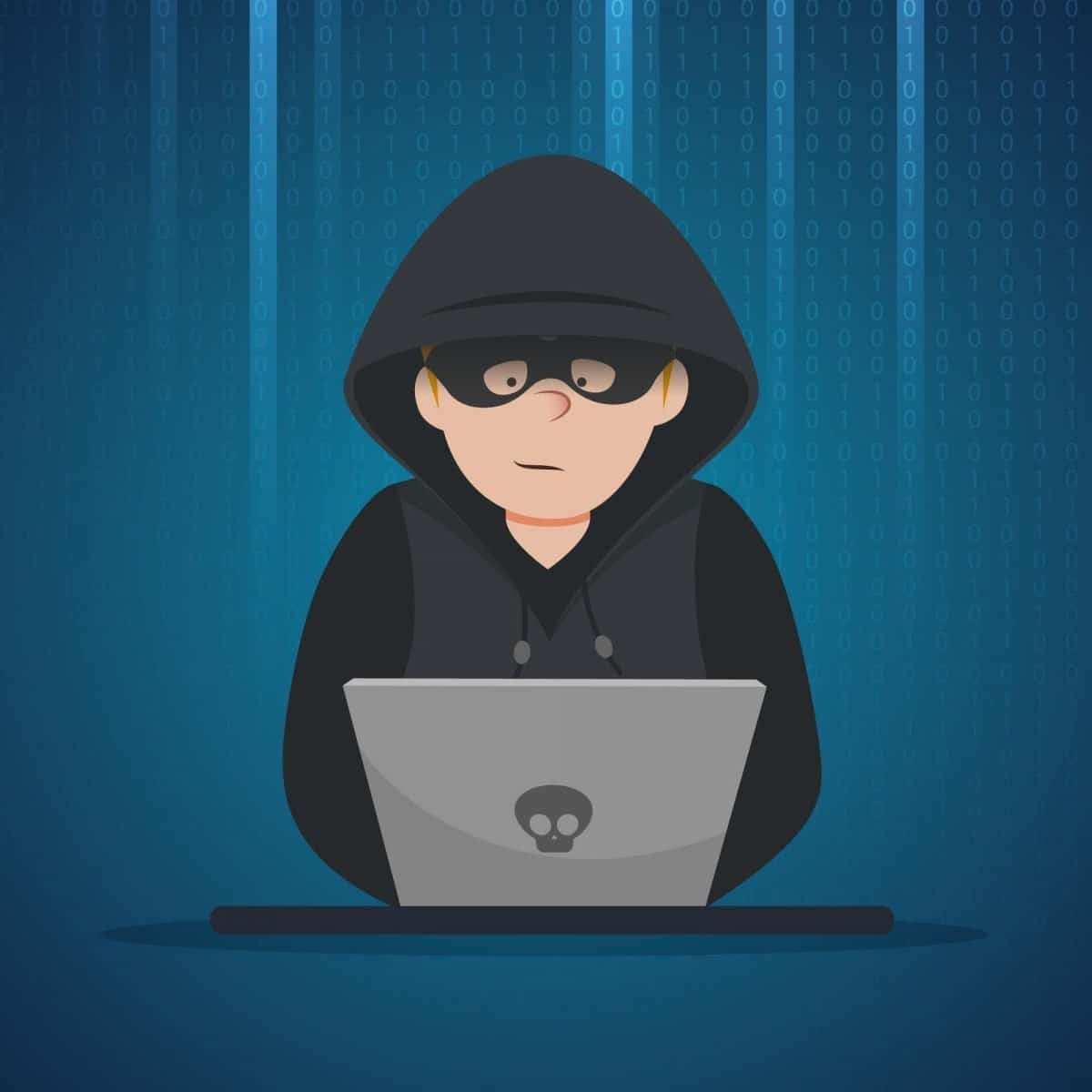 An illustration of a hacker using a laptop