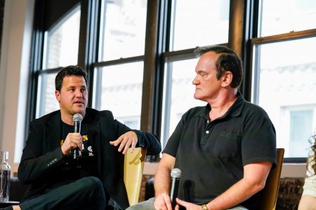 Photo of SCRT Labs CEO Guy Zyskind and Quentin Tarantino at a live event panel