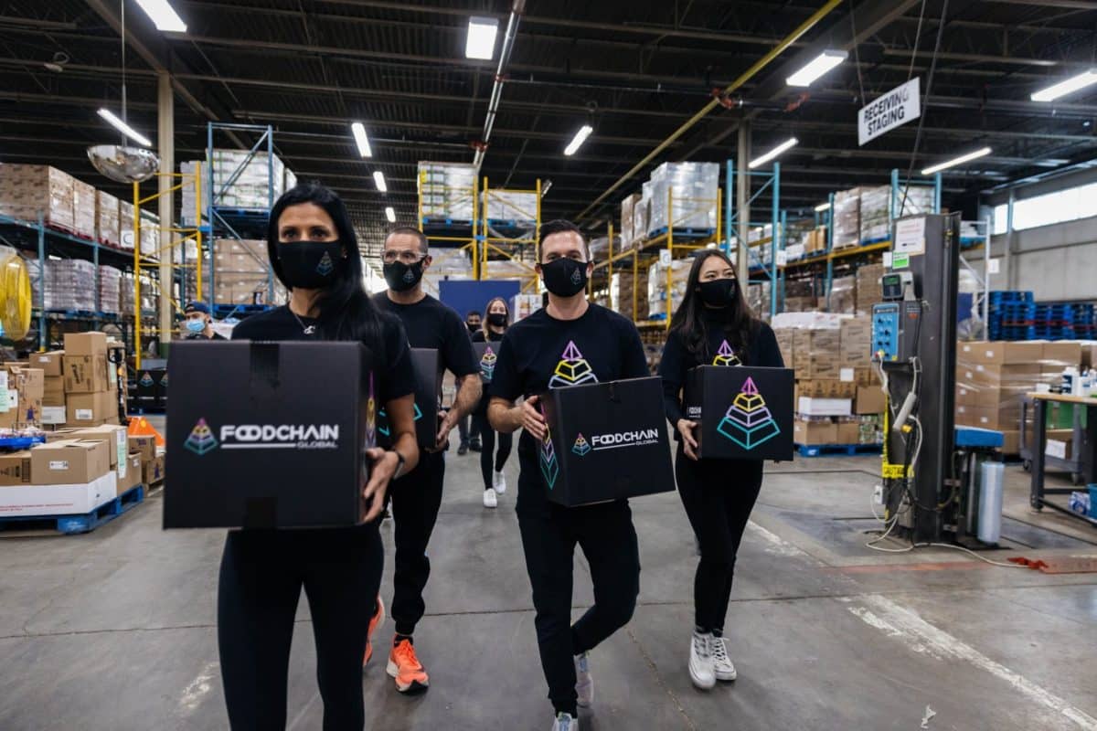 FoodChain Global members carrying boxes