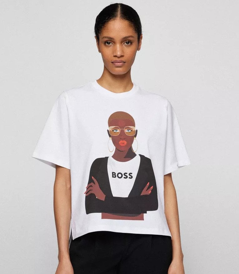 A woman wearing a tshirt from Boss Beauties NFT merch drop