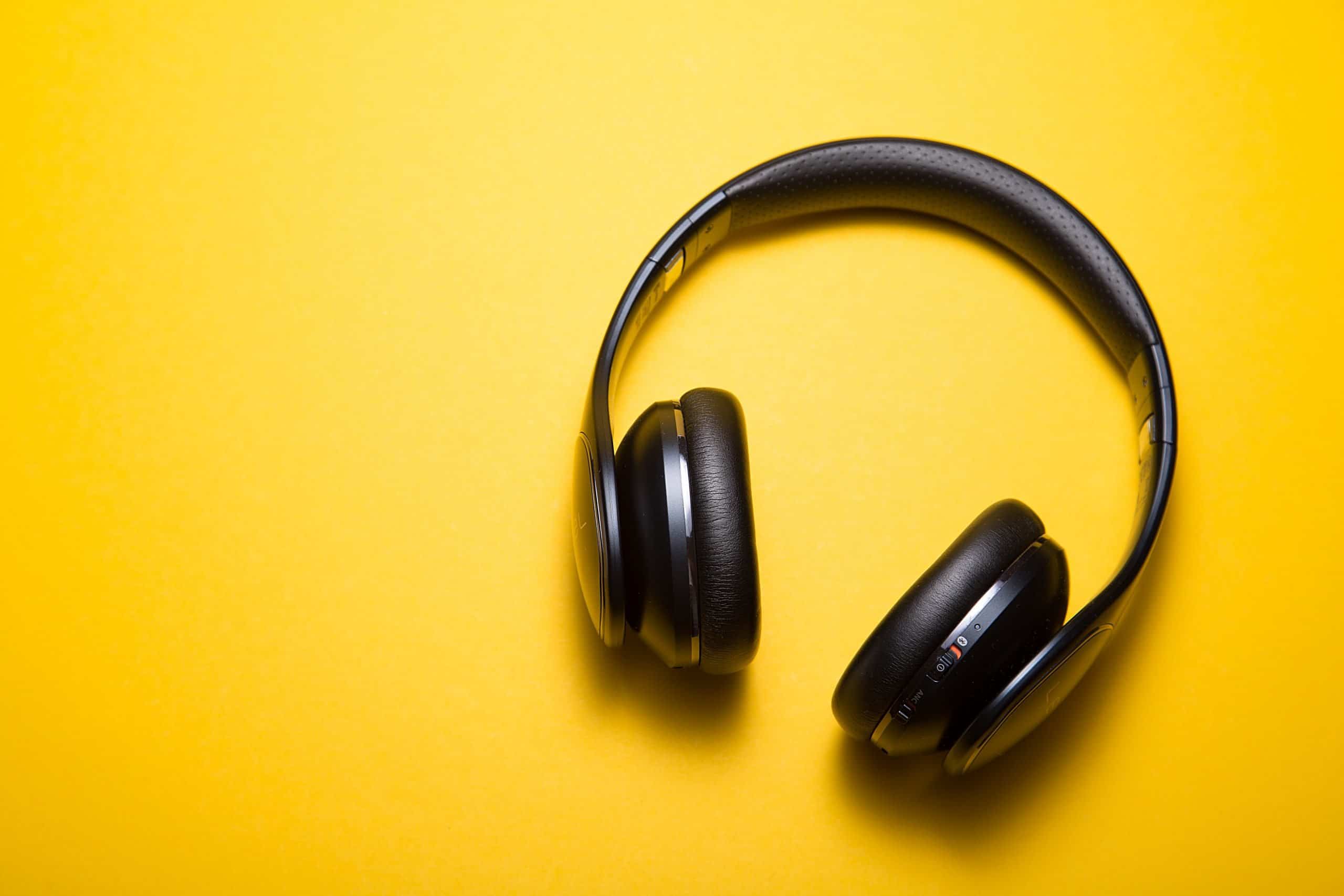 An earphone on a yellow background
