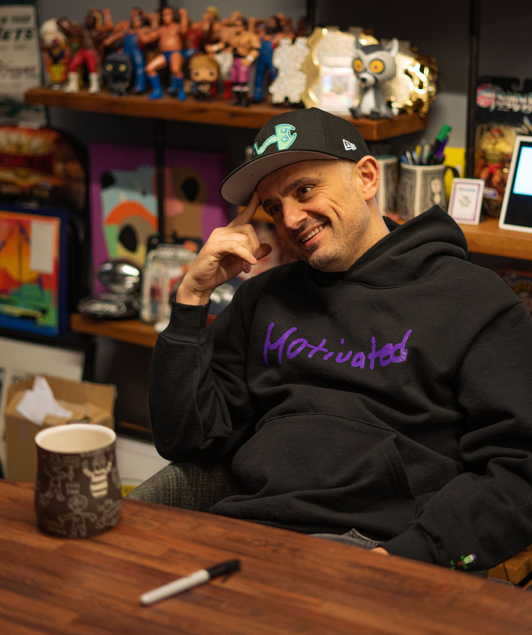 Photo of VeeFriends creator Gary Vee sitting at a table