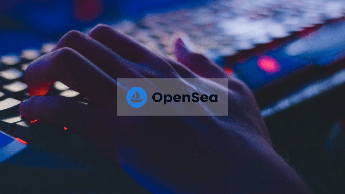 banner opensea logo with hacker hands on keyboard