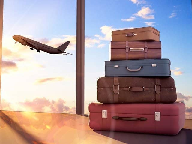 Image of suitcases and a plane taking off VR holiday