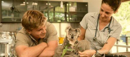 Australia Zoo workers holding a Koala