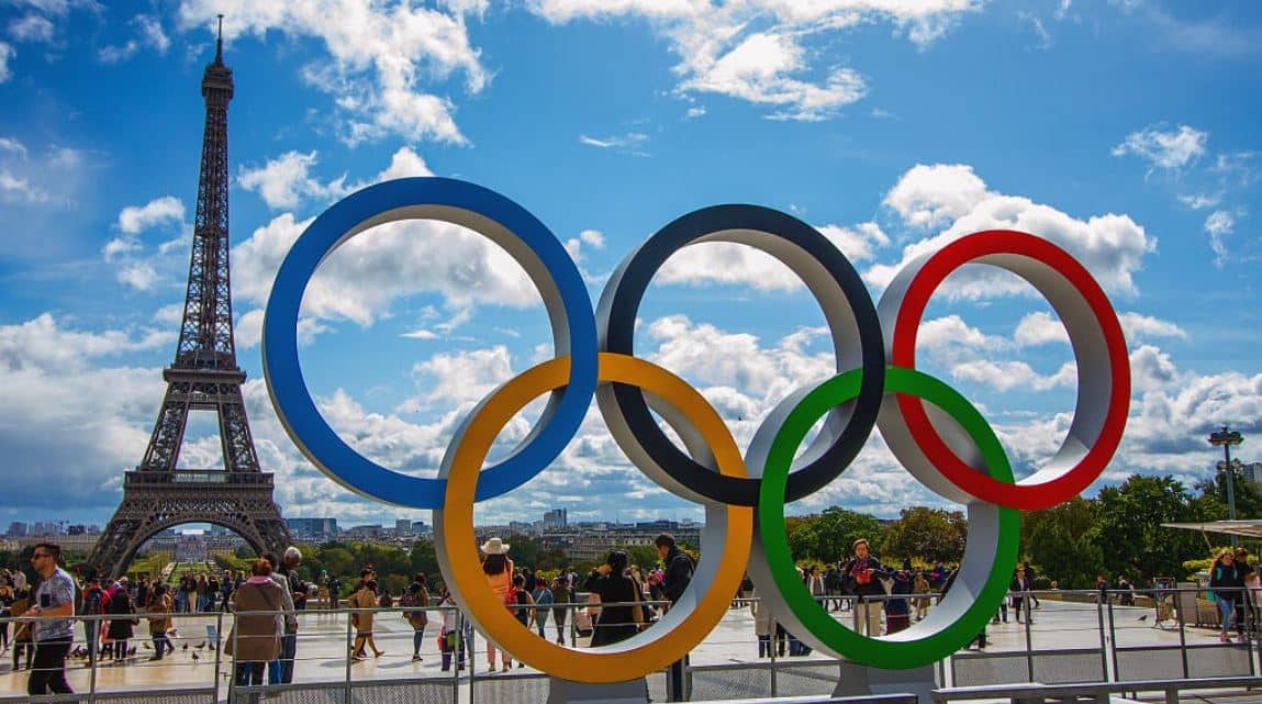 Image of the Olympic Games logo next to the Eiffel Tower in Paris for the 2024 event
