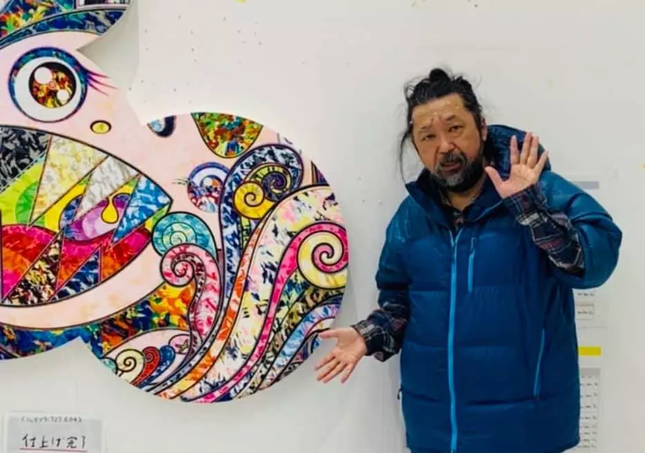 Takashi Murakami with his artwork