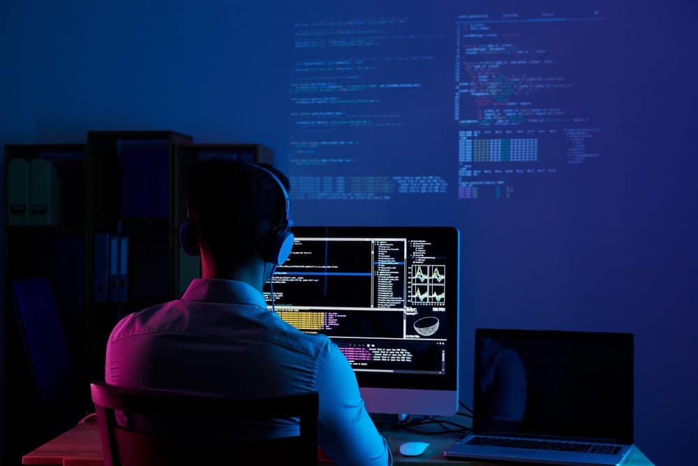A blockchain developer program on a desktop in a dark room