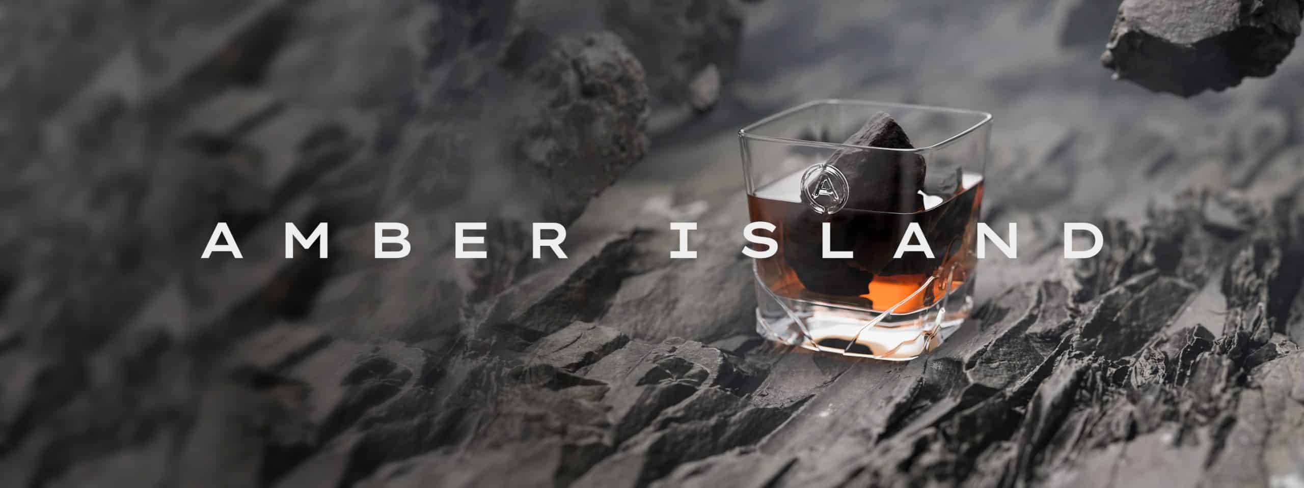 Image of Amber Island text and whisky in glasss