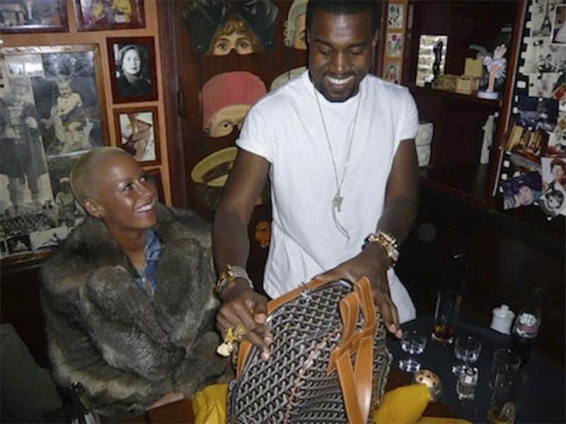 A picture of Kanye West and Amber Rose with a Goyard bag