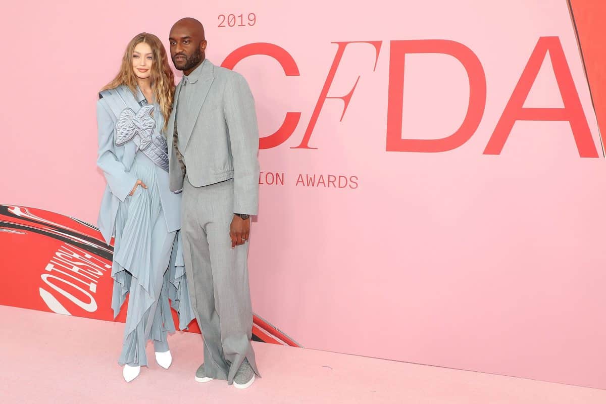 Gigi Hadid and the deceased renowned designed Virgil Abloh stand on a runway. It's for the CFDA NFT Collection to celebrate it's 60th year.