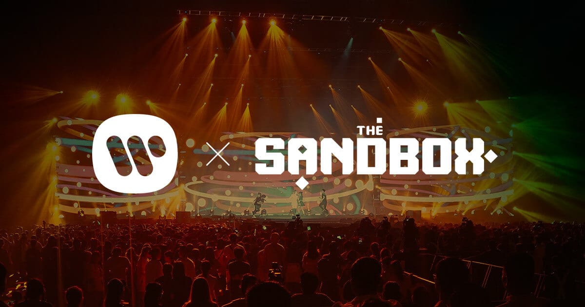 Hay una multitud de personas virtuales frente al escenario, en apoyo de Warner Music Game Jam para The Sandbox.