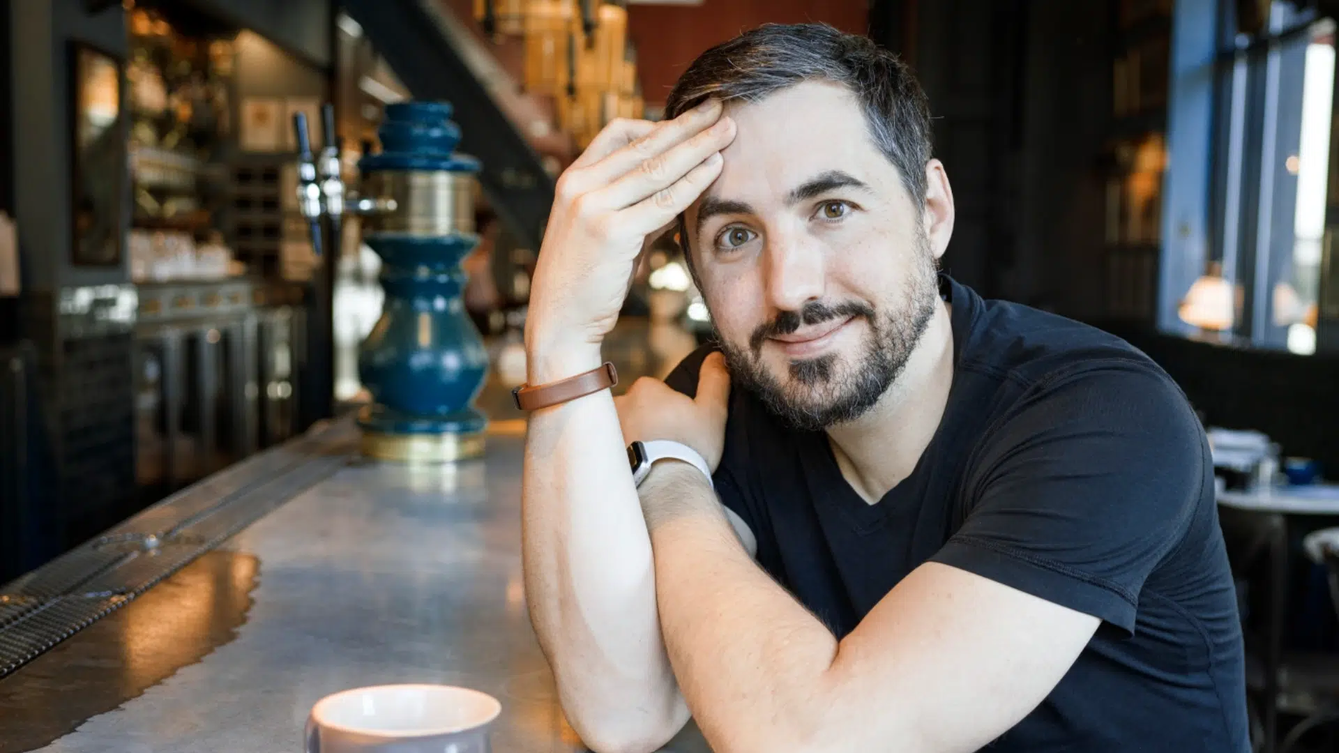 a picture of Moonbirds CEO Kevin rose at a cafe. The founder lost around $2 million worth of NFTs earlier this week.