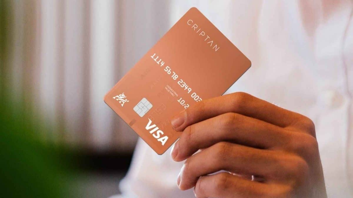A tan Criptan credit card is seen being used in a transaction.