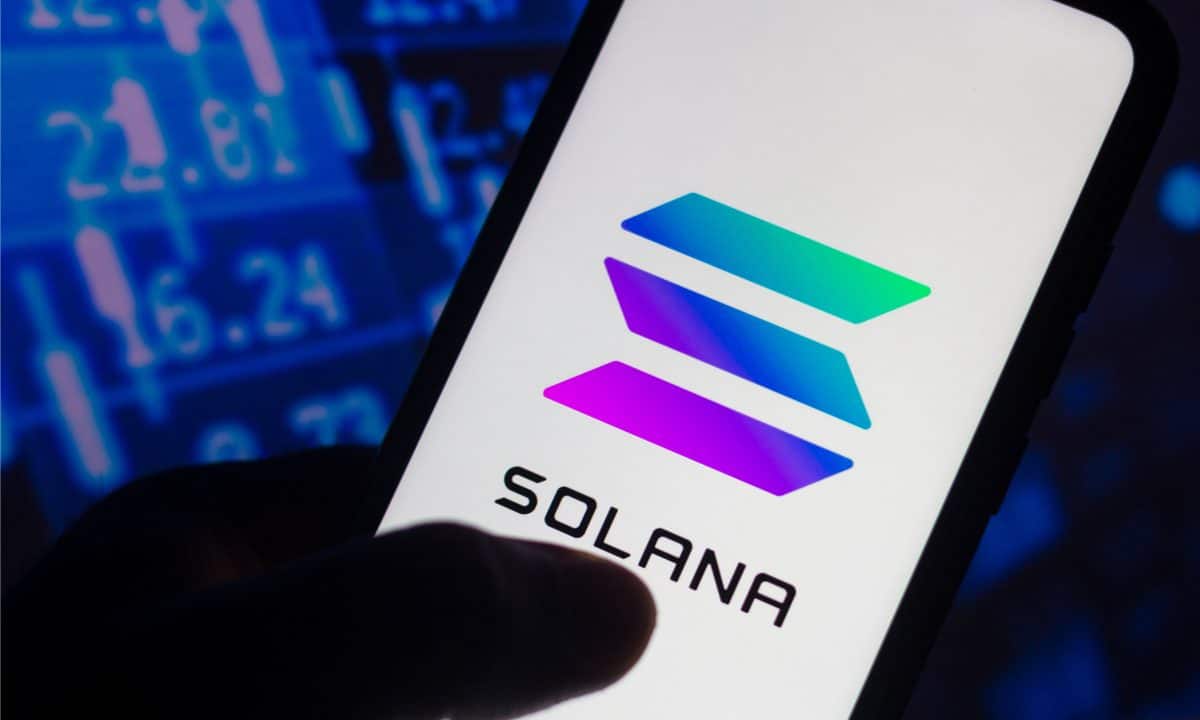 A mobile phone displaying the Solana blockchain logo