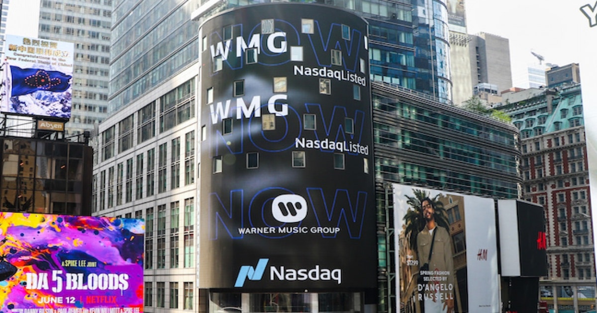 A billboard showing the Warner Music Group ticker in New York City.