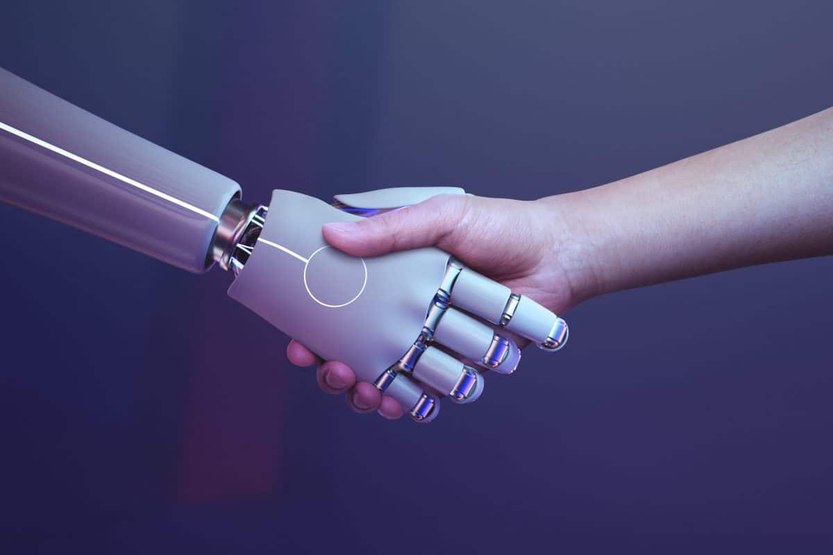 image of a robot handshake with a human