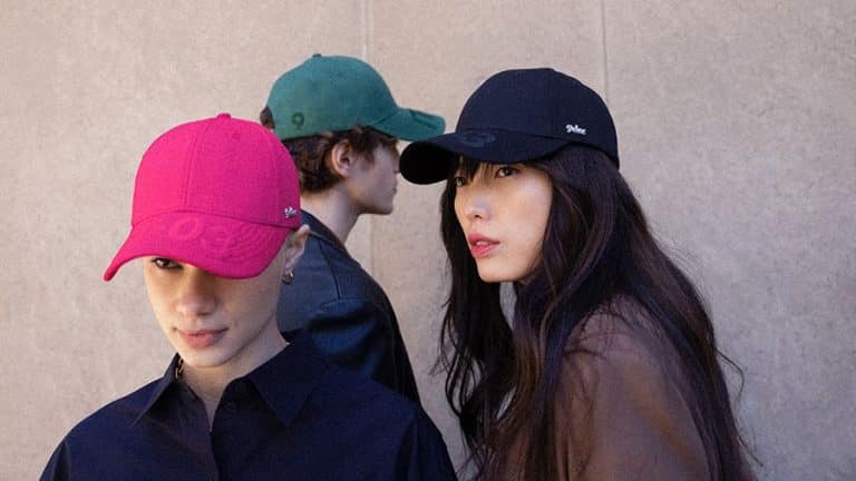 Image of 3 people wearing different caps - pink, green, and black - for the 9dcc NFT NYC treasure hunt